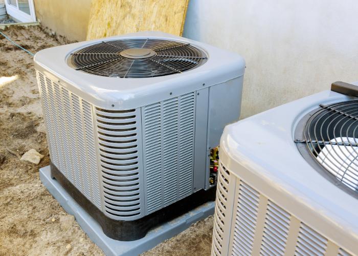 Energy-efficient HVAC units installed outdoors, showcasing modern air conditioning systems relevant to New Jersey homeowners considering upgrades and rebates.